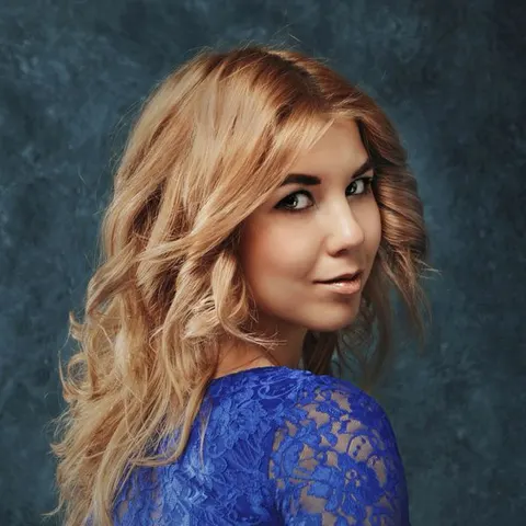 Soft blonde blowout over the shoulder